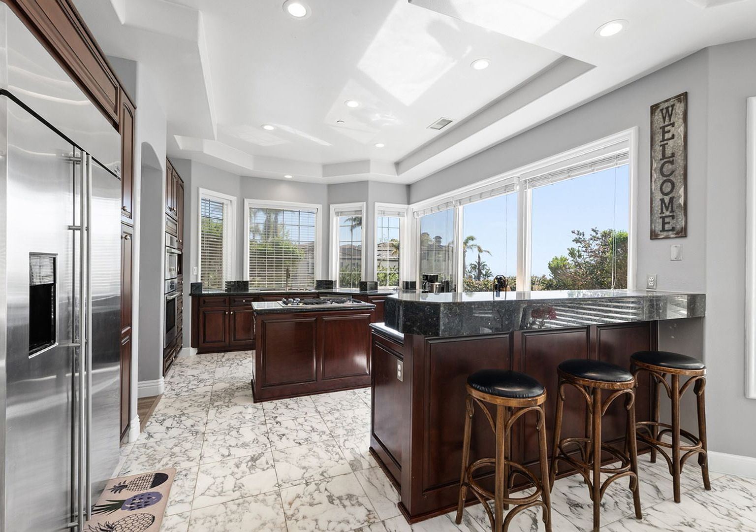 Kitchen with island and view windows at 3 Calle Agua